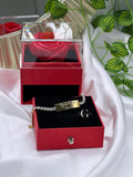 Bracciale “Tennis con piastrina”