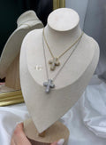 Collana “Croce bombata con zirconi”